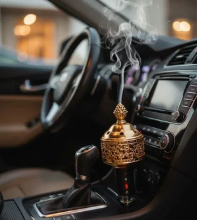 Ornate portable car incense burner emitting smoke on car dashboard interior