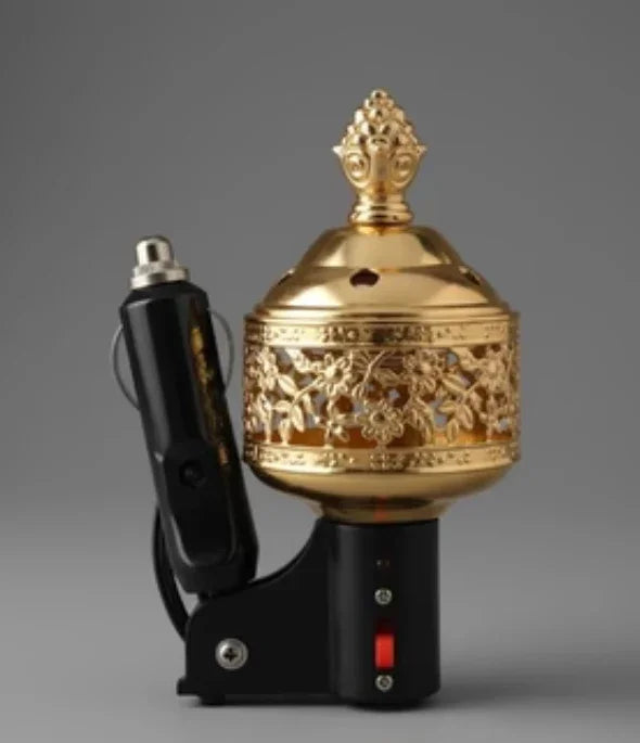 Ornate gold electric car incense burner with floral patterns and black power adapter