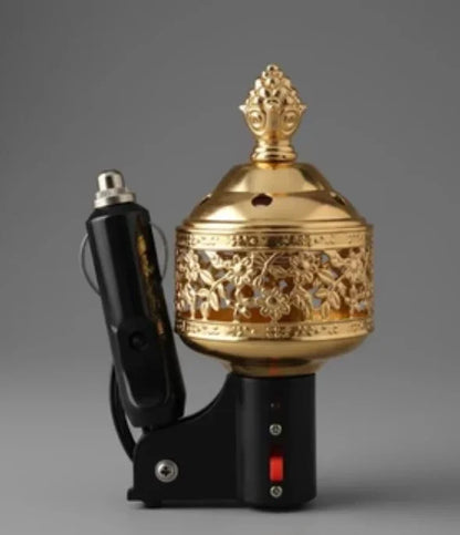Ornate gold electric car incense burner with floral patterns and black power adapter