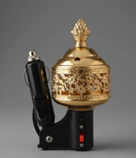 Ornate gold electric car incense burner with floral patterns and black power adapter