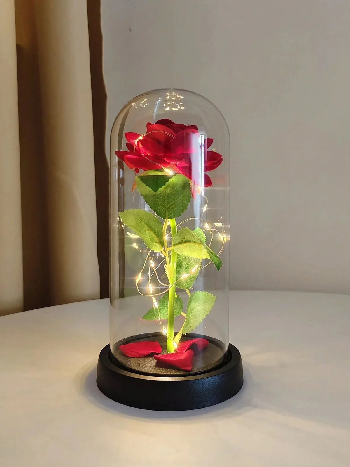 Enchanted red rose in glass dome with LED fairy lights, decorative home accent