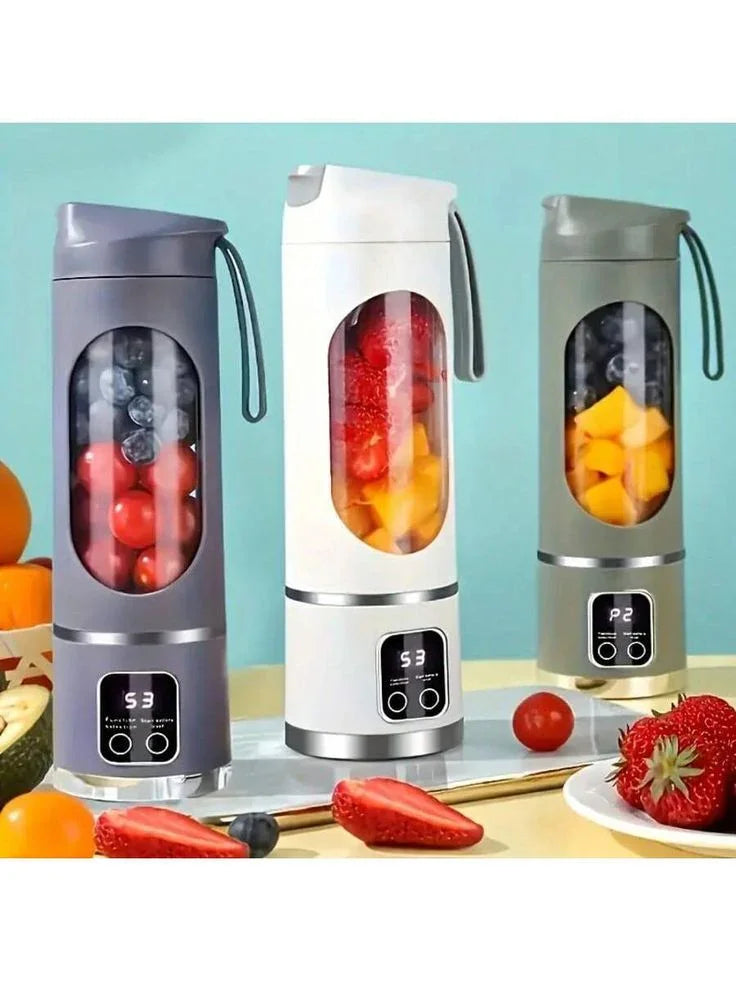 Portable USB rechargeable mini blenders with digital display, filled with fruit, on a kitchen counter.