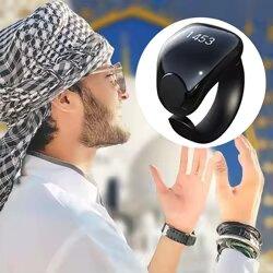 Man in traditional attire praying outdoors with digital prayer ring close-up inset