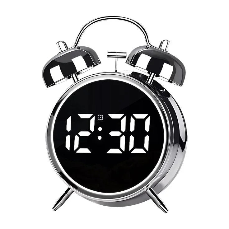 Silver twin bell alarm clock with LED digital display and night light, showing 12:30