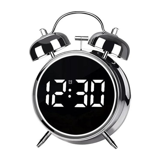 Silver twin bell alarm clock with LED digital display and night light, showing 12:30